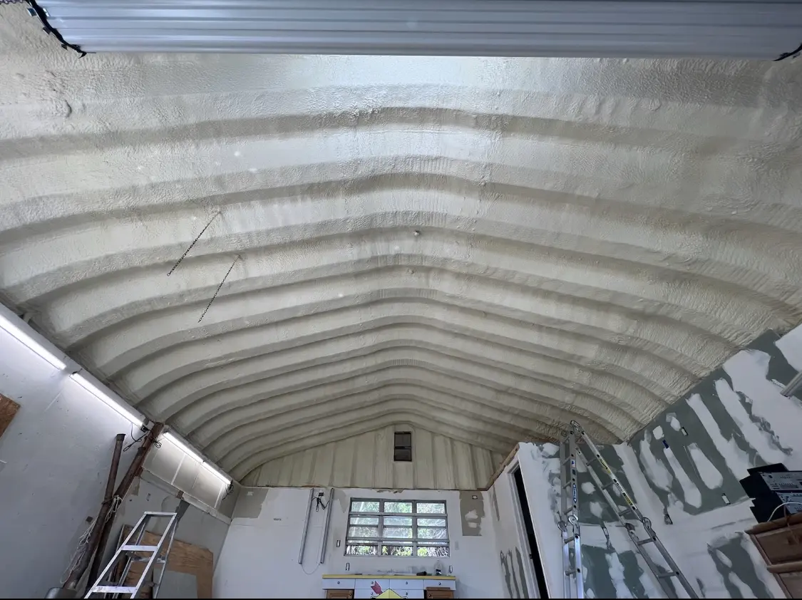 Spray polyurethane foam applied to the underside of a metal roof deck in Lincolnton